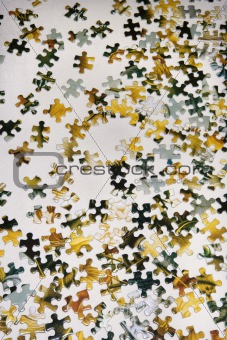 Still life of puzzle pieces on table.