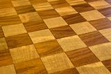 Brown and tan checkered wooden floor.