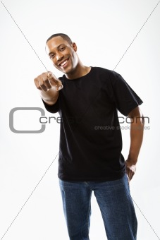 Young African-American man pointing at viewer.