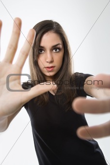 Teenage girl with hands in foreground.