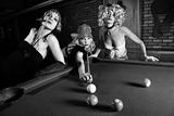 Three retro females shooting pool.