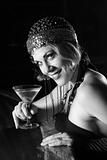 Retro female sitting at bar with martini.