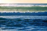 surf wave breaks in the ocean