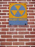 "Signs": Old Nuclear Fallout Shelter Sign on Brick