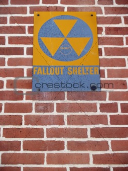 "Signs": Old Nuclear Fallout Shelter Sign on Brick