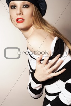 Fashion  portrait of the girl in a striped jumper