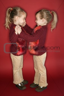 Female children twins dancing.