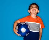 Male boy holding soccer ball.