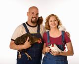 Caucasian woman and man with chickens.