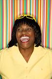 Adult African-American female laughing.
