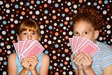 Girls holding cards.