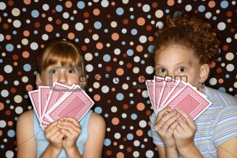 Girls holding cards.