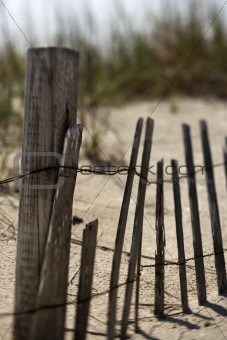 Fence on sand dune on Bald Head Island, North Carolina.