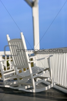 Rocking chairs on porch on Bald Head Island, North Carolina.