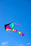 Kite flying in blue sky.