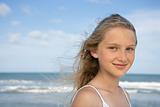 Portrait of pre-teen girl with ocean in background.