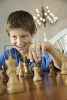 Boy playing chess.