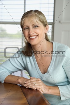Woman sitting at table.