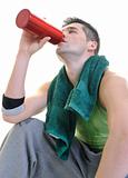 sportsman relaxing and drinking water