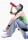 sportsman relaxing and drinking water