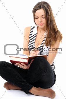  Beautiful girl doing homework on a white background