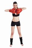 Female boxer looking very focused with red gloves