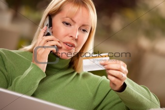 Cheerful Woman on Her Phone and Laptop with Credit Card.