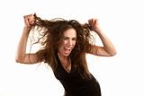 Pretty woman with wild brunette hair on white background