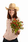 Pretty young brunette woman with cowboy hat and flowers