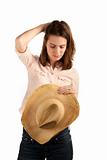 Pretty young brunette woman with cowboy hat