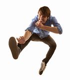 Tall handsome hipster man on white background jumping
