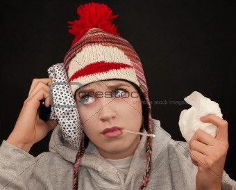 Sick young woman with thermometer and monkey cap