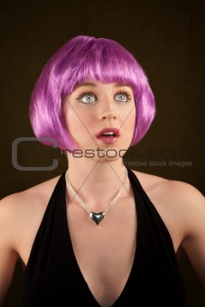 Portrait of woman with shiny purple hair 