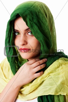 Face with green eyes and scarf