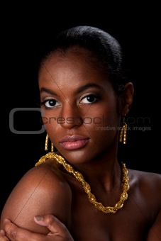 African woman face with gold jewelry