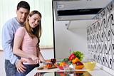 couple have fun and preparing healthy food in kitchen