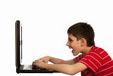 Kid is playing computer game on the laptop