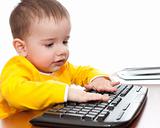 Toddler typing on the keyboard