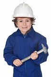 Adorable worker child with a hammer