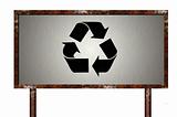 Rusty sign with recycling symbol
