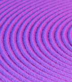 Abstract pattern - concentric circles on purple sand