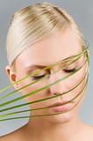 girl with grass over face