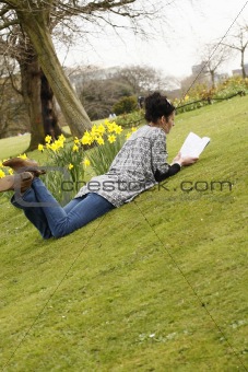 young woman reads book 