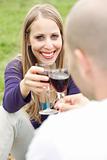 Young romantic couple celebrating with wine