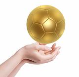 golden soccer ball in hand