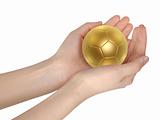 golden soccer ball in hand