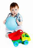 Boy with baloon and toy truck