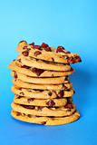 shot of chocolate chip cookie stack on blue vertical