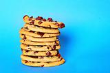 shot of chocolate chip cookie stack on blue