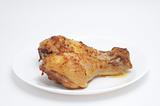 Chicken legs on a plate prepared product.